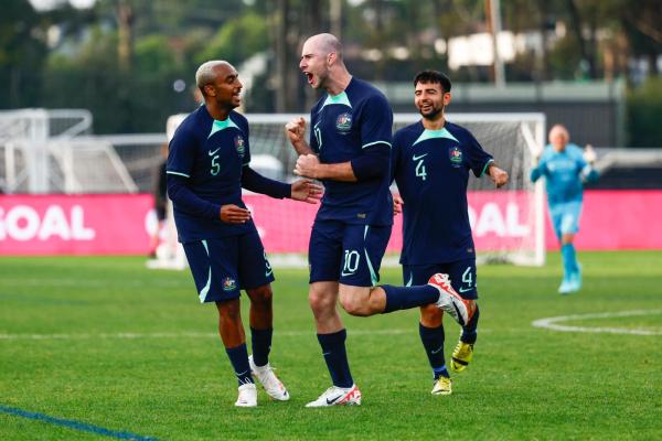Connor Bunce celebrates scoring against Japan. (L-R) - Daniel Campbell, Connor Bunce, Alessandro La Verghetta